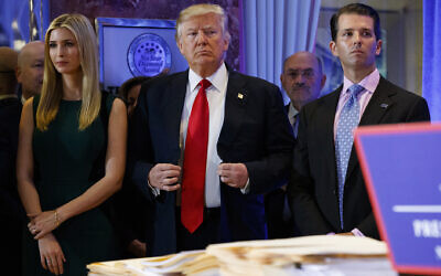 Then US president-elect Donald Trump, center, stands next to Allen Weisselberg, second from left, Donald Trump Jr., right and Ivanka Trump, left, at a news conference in the lobby of Trump Tower in New York, on January 11, 2017. (AP Photo/Evan Vucci/File)