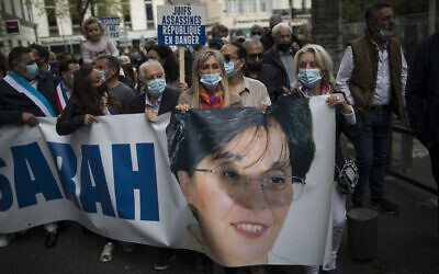 Protesters march with a banner of killed Jewish woman Sarah Halimi, during a demonstration in Marseille, southern France, April 25, 2021 (AP Photo/Daniel Cole)