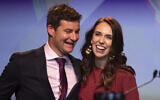 In this Oct. 17, 2020, file photo, New Zealand Prime Minister Jacinda Ardern, right, is congratulated by her partner Clarke Gayford following her victory speech to Labour Party members at an event in Auckland, New Zealand (AP Photo/Mark Baker, File)