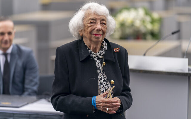 Holocaust Survivor Margot Friedlander steps away from the podium after speaking at a ceremony attended by US Secretary of State Antony Blinken and then-German Minister of Foreign Affairs Heiko Maas, left, for the launch of a US-Germany Dialogue on Holocaust Issues at the Memorial to the Murdered Jews of Europe in Berlin, June 24, 2021. (AP Photo/Andrew Harnik, Pool)
