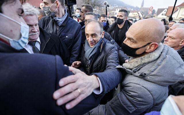 Eric Zemmour, far right candidate for the French presidential election 2022, gestures as he visits a vineyard and meets local supporters in Husseren-les-chateaux, eastern France, December 18, 2021. (AP Photo/Jean-Francois Badias)