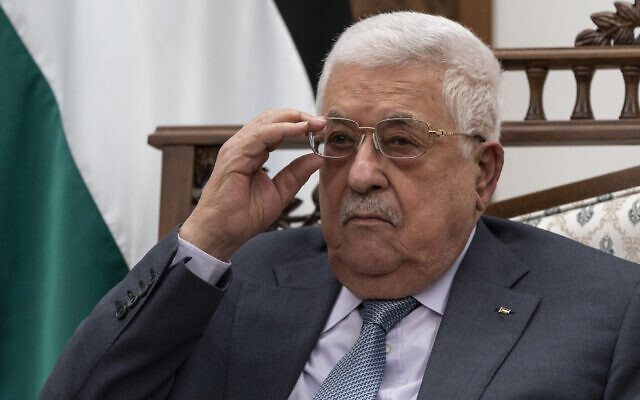 Palestinian Authority President Mahmoud Abbas adjusts his glasses as he listens during a joint statement with US Secretary of State Antony Blinken, on May 25, 2021, in the West Bank city of Ramallah. (AP Photo/Alex Brandon, Pool, File)