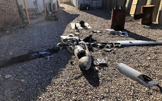Parts of the wreckage of a drone are laid out on the ground near the Ain al-Asad airbase, in the western Anbar province of Iraq, Tuesday, Jan. 4, 2022. (International Coalition via AP)