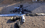 Parts of the wreckage of a drone are laid out on the ground near the Ain al-Asad airbase, in the western Anbar province of Iraq, January 4, 2022. (International Coalition via AP)
