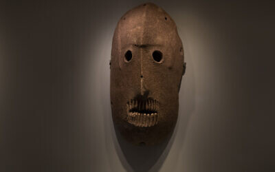A Neolithic mask loaned by American billionaire Michael Steinhardt, is displayed at the Israel Museum in Jerusalem, Wednesday, Jan. 5, 2022. Last month, Steinhardt surrendered the artifact, along with 179 others as part of a landmark deal with the Manhattan District Attorney's office to avoid prosecution.  (AP Photo/Maya Alleruzzo)