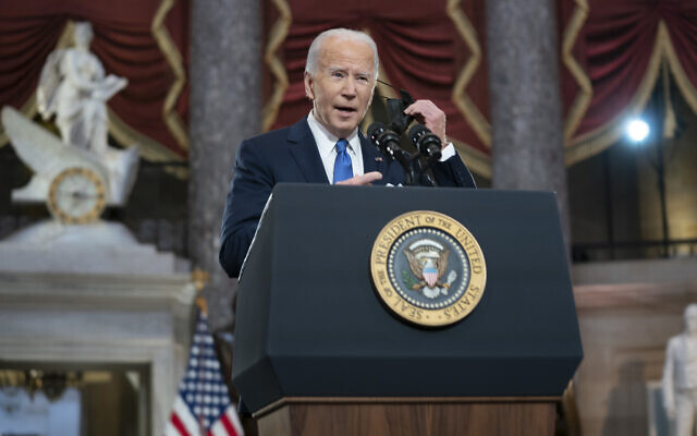 US President Joe Biden he speaks from Statuary Hall at the US Capitol to mark the one year anniversary of the riot at the Capitol by supporters loyal to then-president Donald Trump, in Washington, DC, on January 6, 2022. (Greg Nash/Pool via AP)