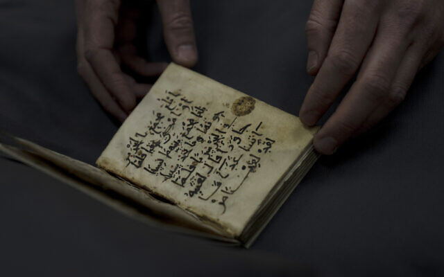 An early Quran, part of the collection of the National Library of Israel, is displayed at The Hebrew University campus in Jerusalem, January 6, 2022. (AP Photo/ Maya Alleruzzo)