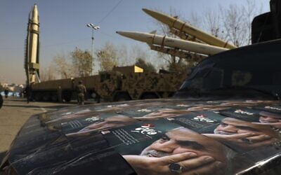 Illustrative: Posters of Iranian Gen. Qassem Soleimani, who was killed in Iraq in a US drone attack on January 3, 2020, are seen in front of Qiam, background left, Zolfaghar, top right, and Dezful missiles displayed in a missile capabilities exhibition by the paramilitary Revolutionary Guard at Imam Khomeini grand mosque, in Tehran, Iran, January 7, 2022 (AP Photo/Vahid Salemi)