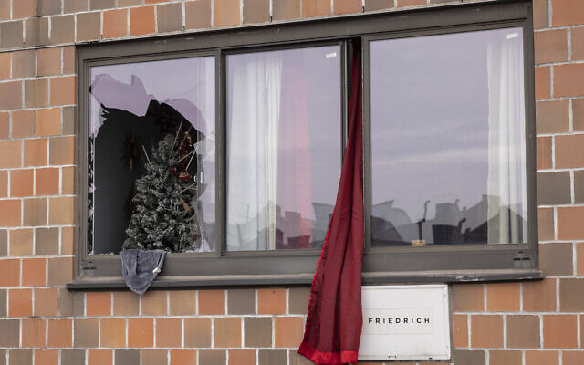 A curtain hangs outside a window at an apartment building in the Bronx on January 9, 2022, in New York, where a fatal fire occurred, in what the city's fire commissioner called one of the worst blazes in recent memory. (AP Photo/Yuki Iwamura)