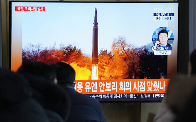 People watch a TV showing a file image of North Korea's missile launch during a news program at the Seoul Railway Station in Seoul, South Korea, on Tuesday, January 11, 2022. (AP Photo/Ahn Young-joon)