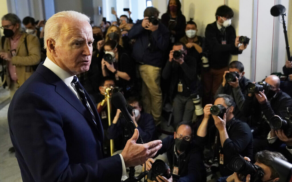 US President Joe Biden speaks to the media after meeting privately with Senate Democrats, Jan. 13, 2022, on Capitol Hill in Washington. (AP Photo/Andrew Harnik)
