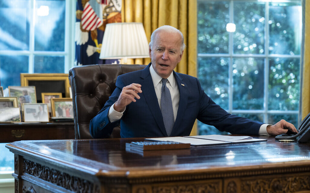 US President Joe Biden speaks before signing an executive order to improve government services, in the Oval Office of the White House, Dec. 13, 2021, in Washington. (AP Photo/Evan Vucci, File)