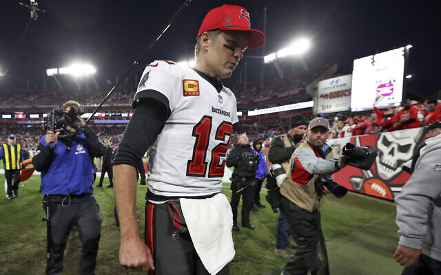 Tampa Bay Buccaneers quarterback Tom Brady (12) reacts as he leaves the field after the team lost to the Los Angeles Rams during an NFL divisional round playoff football game, on January 23, 2022, in Tampa, Florida. (AP Photo/Mark LoMoglio) Tampa Bay Buccaneers quarterback Tom Brady (12) reacts as he leaves the field after the team lost to the Los Angeles Rams during an NFL divisional round playoff football game, on January 23, 2022, in Tampa, Florida. (AP Photo/Mark LoMoglio)