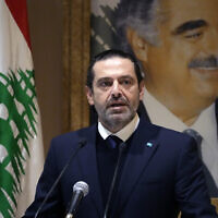 Former Lebanese Prime Minister Saad Hariri speaks during a press conference in front of a picture of his late father and former Prime Minister of Lebanon Rafic Hariri, at his house in downtown Beirut, Lebanon, Jan. 24, 2022. (Hussein Malla/AP)