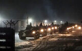 In this photo provided by Vayar Military Agency, January 25, 2022, Belarusian military vehicles gather preparing to attend Belarusian and Russian joint military drills in Belarus. (Vayar Military Agency Agency via AP)