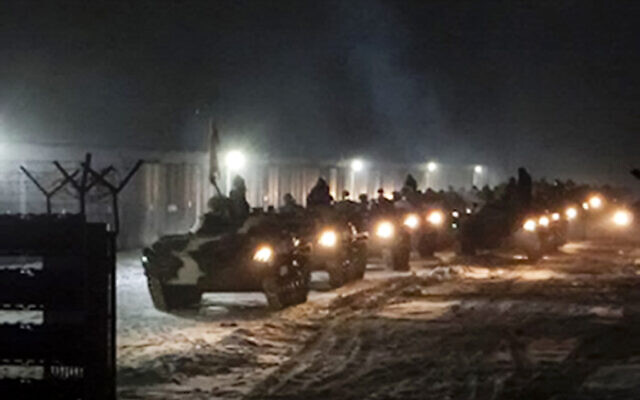 In this photo provided by Vayar Military Agency, January 25, 2022, Belarusian military vehicles gather preparing to attend Belarusian and Russian joint military drills in Belarus. (Vayar Military Agency Agency via AP)