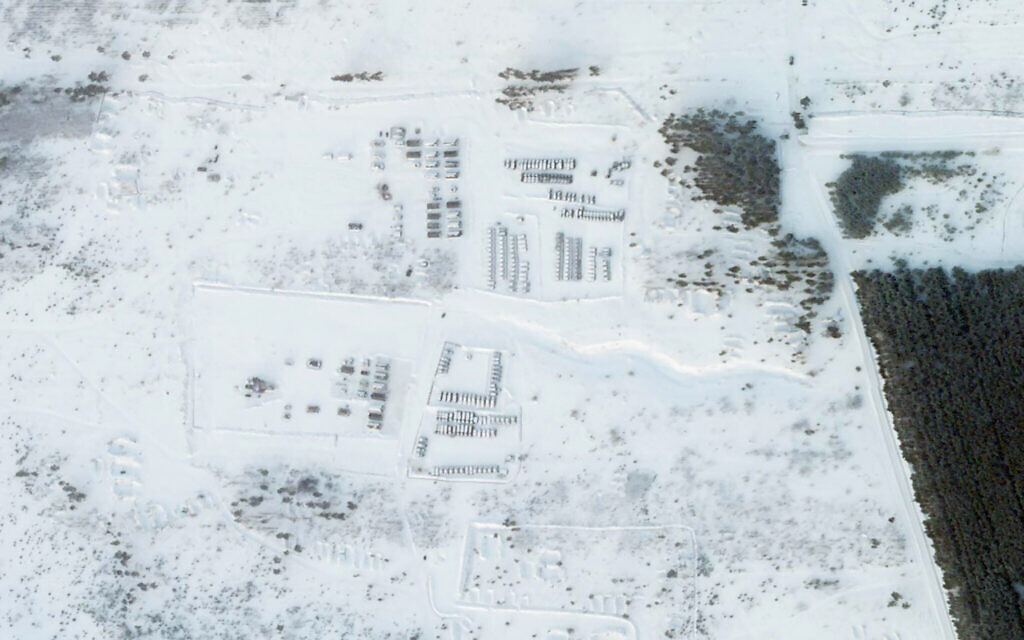 This satellite image provided by Planet Labs PBC shows vehicles and tanks stationed at the Pogonovo training area just south of the city of Voronezh, Russia, Jan. 26, 2022 (Planet Labs PBC via AP)