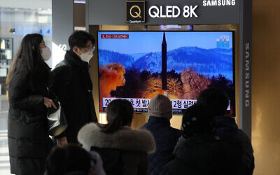 People watch a TV showing an image of North Korea's missile launch during a news program at the Seoul Railway Station in Seoul, South Korea, Jan. 31, 2022. (Ahn Young-joon/AP)