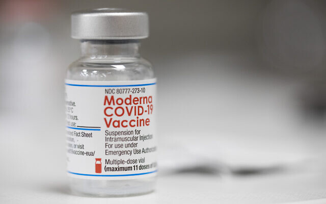 A vial of the Moderna COVID-19 vaccine is displayed on a counter at a pharmacy in Portland, Oregon, December 27, 2021. (AP Photo/Jenny Kane)