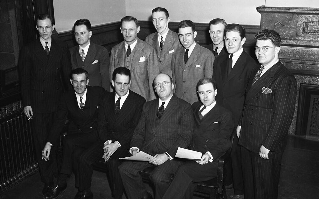 The Christian Front trial in New York on April 9, 1940. Seated left to right: LaRoy Keegan, John Viebrock, Leo Healy (the attorney defending 11 of the Christian Front members), and John Cassidy. Back row left to right: John F. Cook, Nick Ernecke, Macklin Boettiger, Francis Malone, Edward Walsh, Michael Vill, John Graf, William Bushnell. (AP Photo)
