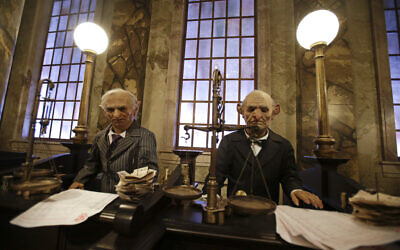 Animatronic bank tellers at Gringotts Bank, part of The Wizarding World of Harry Potter in Orlando, Florida, are seen on June 19, 2014. (AP Photo/John Raoux)