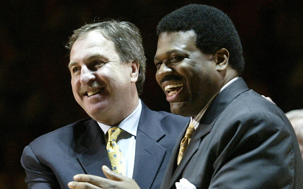 Former Tennessee basketball players Bernard King, right, and Ernie Grunfeld, laugh during a ceremony to retire King's #53 jersey during halftime of the Tennessee-Kentucky game in Knoxville, Tennessee, February 13, 2007. (AP Photo/Wade Payne, File)