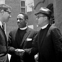 Three of 10 freedom riders on trial at Tallahassee, Florida, for unlawful assembly confer during a court recess on June 22, 1961. Talking are (from left) Rabbi Israel Dresner, the Rev. A.L. Hardge and the Rev. Robert Storm. (AP Photo)