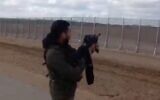 Screen capture from video of an IDF soldier firing across the Israeli-Gaza border in a clip that was posted on the TikTok video-sharing app. (Twitter)