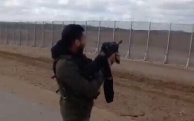 Screen capture from video of an IDF soldier firing across the Israeli-Gaza border in a clip that was posted on the TikTok video-sharing app. (Twitter)