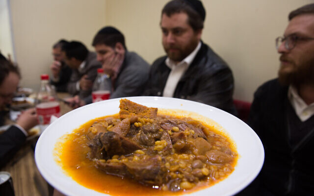 Ultra-Orthodox Jews enjoy eating chulent,  a traditional Jewish stew, at Yoel's restaurant in Meah Shearim, Jerusalem. Many of the restaurants in Meah Shearim open late on Thursday nights to serve chulent. December 24, 2015.(Nati Shohat/Flash90)