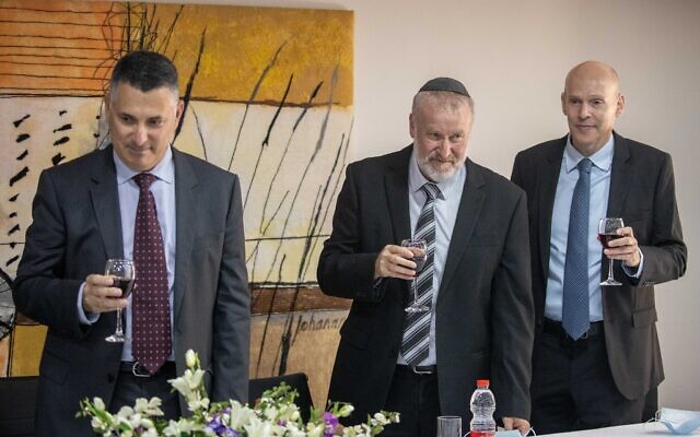 Justice Minister Gideon Sa'ar, left, Attorney General Avichai Mandelblit, center, and State Prosecutor Amit Aisman attend a ceremony at the Justice Ministry in Jerusalem, June 28, 2021. (Yonatan Sindel/Flash90)