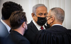 Former prime minister Benjamin Netanyahu arrives at the Jerusalem District Court for a hearing in his ongoing corruption trial, on November 22, 2021. (Oren Ben Hakoon/Pool)