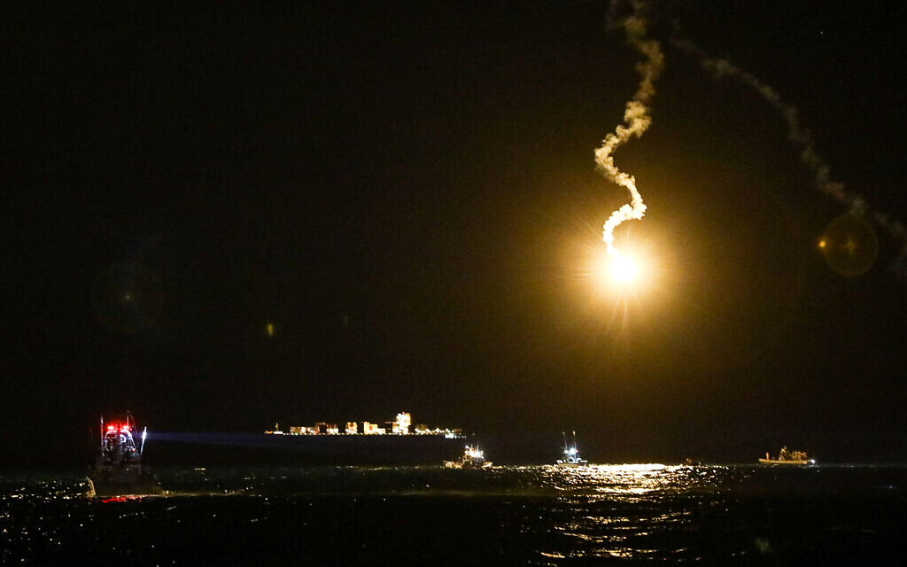 An Israeli army flare illuminates the sky during searches, after a military helicopter crashed off the coast of Haifa on the night of January 3, 2022. (Alon Nadav/Flash90)