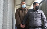 Muntasir Shalabi is brought to the courtroom for a court hearing at the Israel's Ofer military court near the West Bank city of Ramallah, on October 5, 2021. (Flash90)