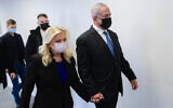 Former prime minister Benjamin Netanyahu and his wife Sara arrive for a court hearing on their lawsuit against former premier Ehud Olmert, at the Tel Aviv Magistrate's Court on January 10, 2022. (Avshalom Sassoni/POOL)