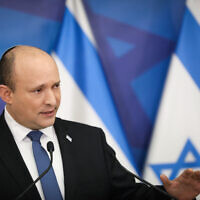 Prime Minister Naftali Bennett holds a press conference in Tel Aviv on January 11, 2022. (Noam Revkin Fenton/Flash90)