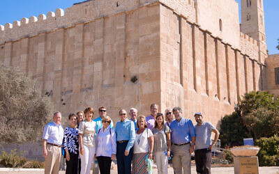 2019 Congressional Tour on the steps of the Tomb of the Patriarchs. In the photo (left to right): General Charles Krulak, Corene McMorris, Olivia Hnat Shields senior staffer to Rep. McMorris Rodgers, Rep. Cathy McMorris Rodgers, Chad Carlough CfS for Rep. Byrne, Clarinda Roe, Rep. Phil Roe, Rep. Bradley Byrne, Rep. Ann Wagner, Ray Wagner, Heather Johnston, Julie Escue (USIEA Director of Tours), Ari Sacher, Rabbi Simcha Hochbaum (courtesy)
