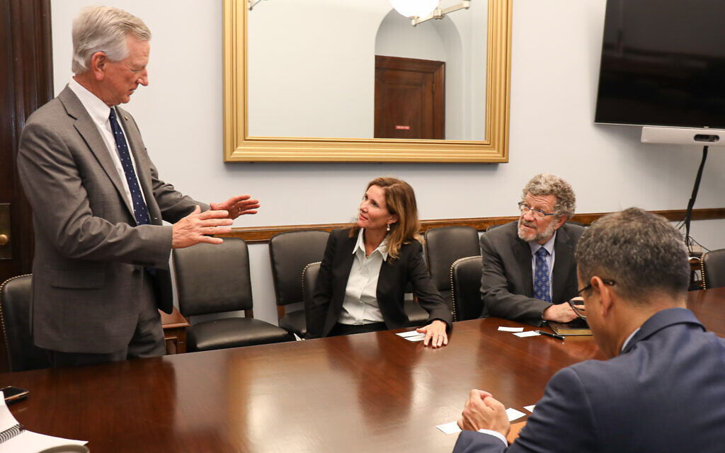 Sen. Tommy Tuberville (Republican-Alabama) discussing opportunities between the Us and Israel with Heather Johnston and Ari Sacher in his office in Washington in 2021 (courtesy)