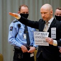 Anders Behring Breivik makes a Nazi salute as he arrives on the first day of the trial where he is requesting release on parole, on January 18, 2022 at a makeshift courtroom in Skien prison, Norway. (Ole Berg-Rusten / NTB / AFP)
