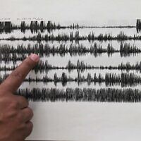 Illustrative: A researcher shows seismograph sensor readings from an earthquake in Mexico, on July 23, 2013. (AP Photo/Marco Ugarte)