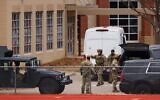 SWAT team members deploy near Congregation Beth Israel Synagogue during a hostage situation in Colleyville, Texas, January 15, 2022. (Andy Jacobsohn/AFP)