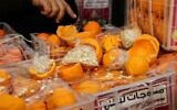 Fake oranges filled with illegal Captagon pills at the Beirut port in Lebanon, on December 29, 2021. (Anwar Amro/AFP)