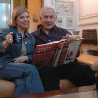 File -- Likud party leader Benjamin Netanyahu poses with his wife Sara in their Jerusalem home on Saturday, 25 march 2006.( Yossi Zamir/Flash90)