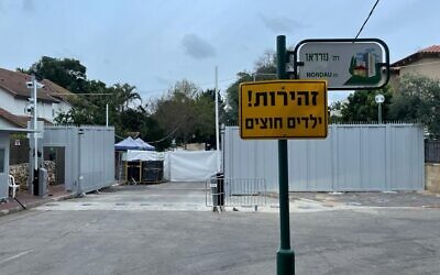 Unfinished construction of one of the three metal wall roadblocks encircling Prime Minister Naftali Bennett's Ra'anana home, January 13, 2022. (Carrie Keller-Lynn/Times of Israel)