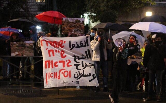 Left-wing activists protest outside Jerusalem Mayor Moshe Leon's home, on January 19, 2022, against evictions in Sheikh Jarrah earlier in the day. (Yahel Gazit)