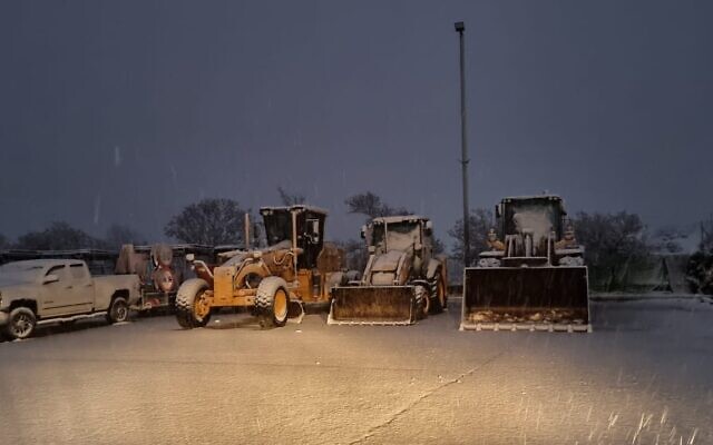 Bulldozers prepare to dipose of snow from roads in northern Israel, January 26, 2022. (Golan Regional Council)