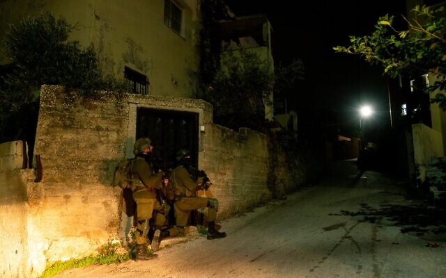 Illustrative: IDF soldiers operating in the West Bank Palestinian town of Silat al-Harithiya, on December 20, 2021. (Israel Defense Forces)