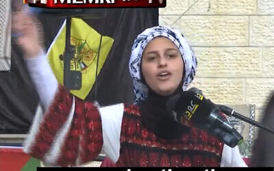 A young Palestinian girl recites a poem in honor of Fatah's founding anniversary at a girls’ primary school in Jenin, West Bank, on December 28, 2021. (Screenshot/MEMRI TV)