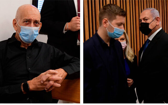 Former prime minister Ehud Olmert (left) and former prime minister Benjamin Netanyahu, wife, Sara, and son, Yair, in the Tel Aviv Magistrate's Court, January 10, 2022, during a preliminary hearing in a defamation lawsuit. (Avshalom Sassoni/Pool Photo via AP)