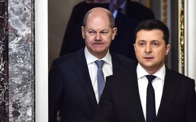 German Chancellor Olaf Scholz (L) and Ukrainian President Volodymyr Zelensky (R) arrive for a joint press conference in Kyiv, on February 14, 2022. (Sergei Supinsky/AFP)